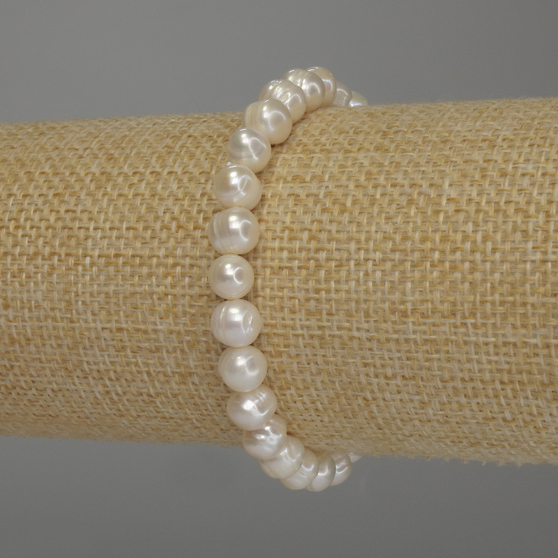 Pulsera de perlas de agua dulce, diámetro 7×6,5 mm ±, longitud 18 cm (elástico)