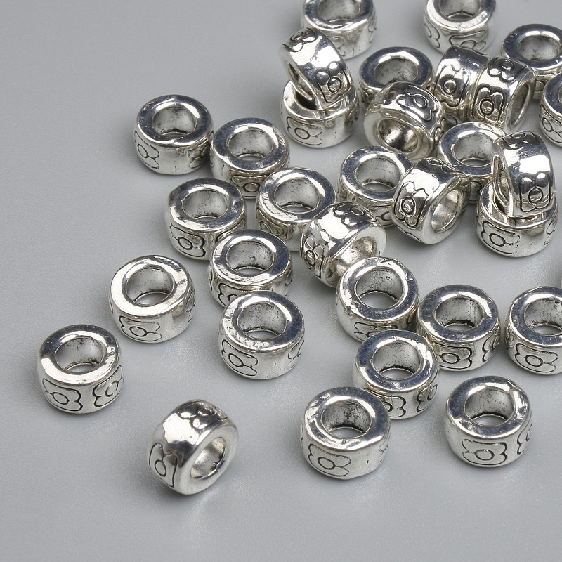 Abalorio-inserto plateado 7×4 mm, agujero ~3,6 mm, empaque 20 g ~35 piezas +