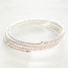 Pulsera espiral fina de tres vueltas con strass blancos pequeños