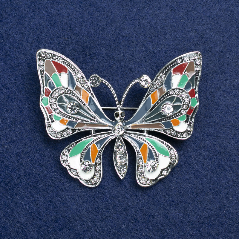 Broche mariposa plateada con esmalte y strass 54x45 mm +